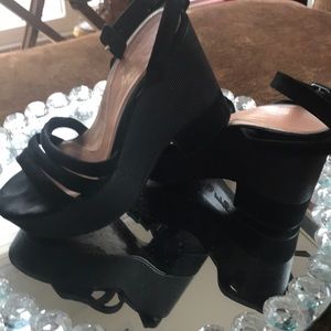 Black suede Clergerie wedges